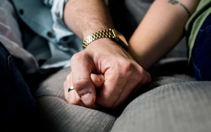 two people holding hands